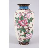 A JAPANESE MEIJI PERIOD CLOISONNE VASE, decorated with scenes of birds amongst foliage upon a pale