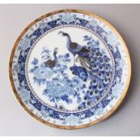 A 20TH CENTURY JAPANESE BLUE & WHITE PEACOCK PORCELAIN PLATE, decorated with scenes of peacocks