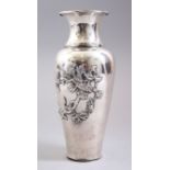 A GOOD CHINESE SOLID SILVER VASE, the body decorated in relief with scenes of birds amongst floral