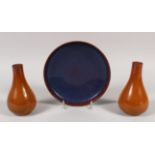 A CHINESE FLAMBE STYLE CERAMIC DISH, 8in diameter; together with a pair of brown glazed pear-form