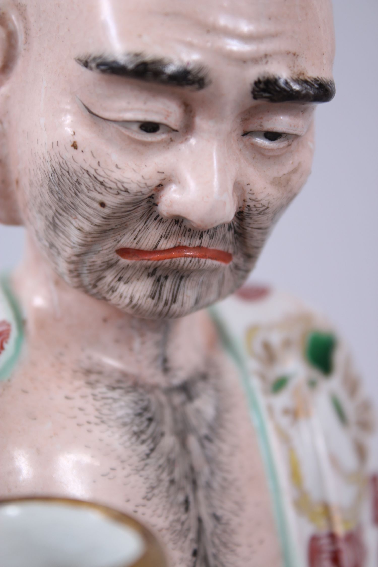 A GOOD JAPANESE KUTANI PORCELAIN MODEL OF AN ARHAT, the arhat with a low expression upon his face, - Image 7 of 8