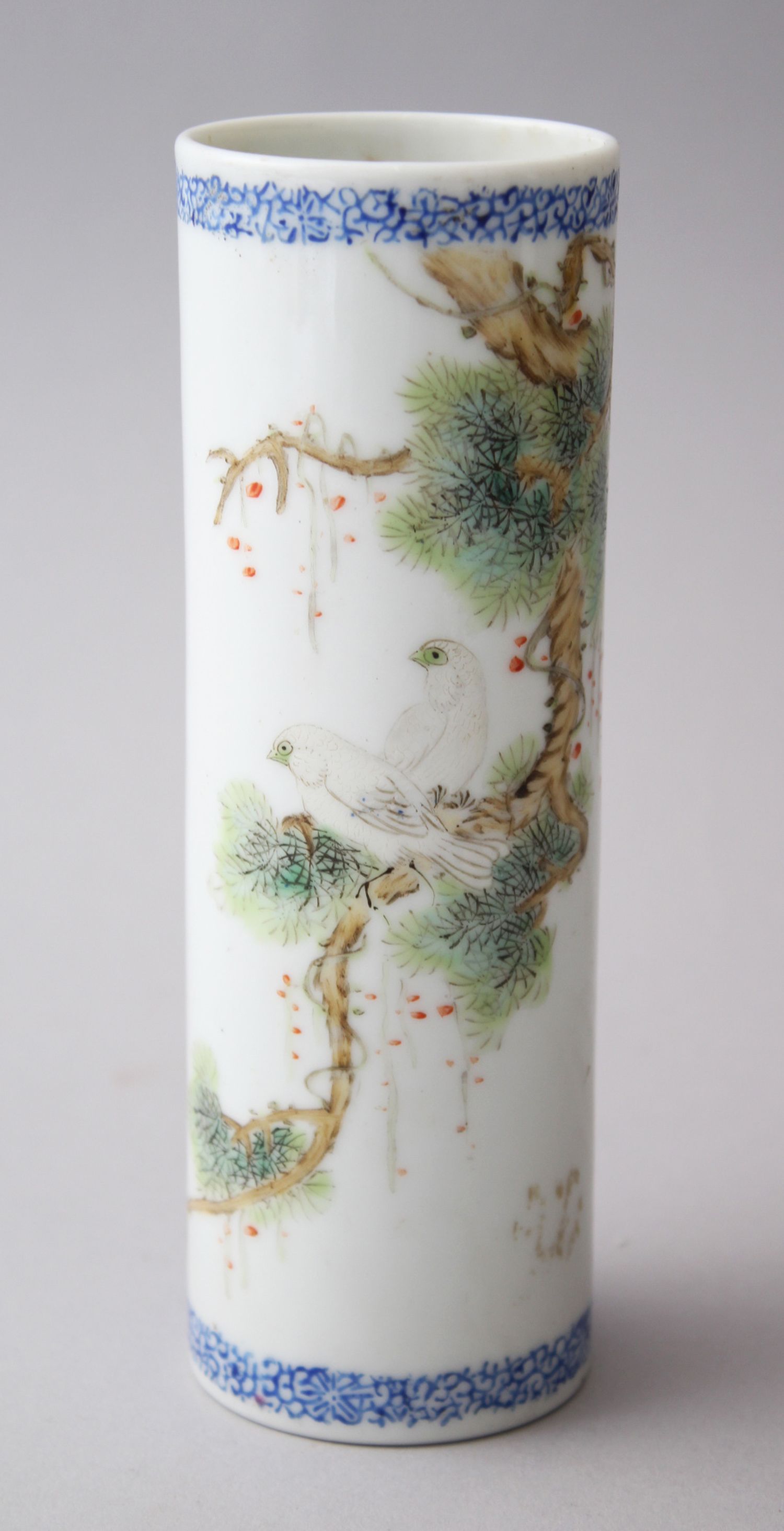 A CHINESE REPUBLICAN BLUE & WHITE CYLINDRICAL PORCELAIN BRUSH POT, with painted enamel scenes of