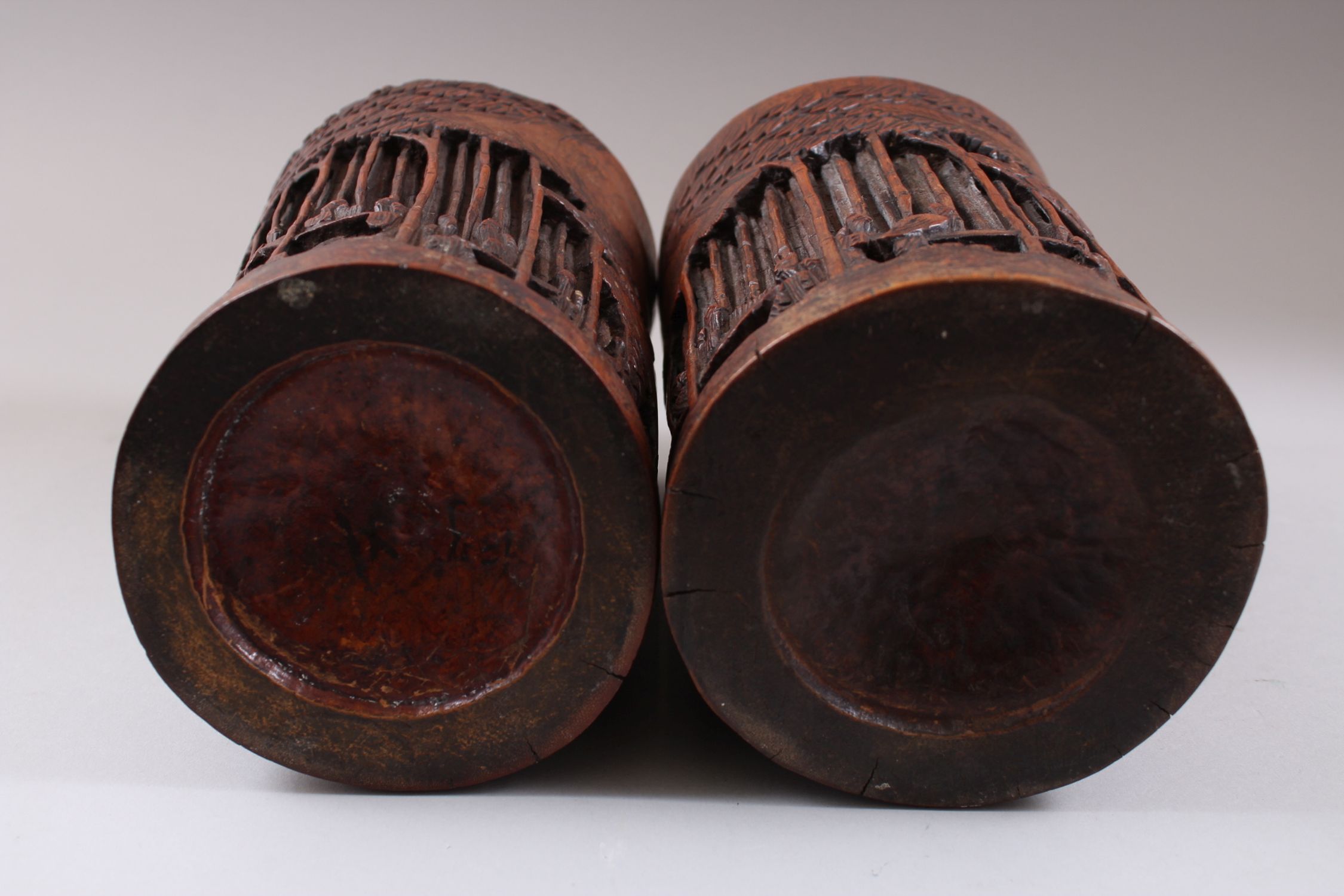 A PAIR OF CHINESE 19TH CENTURY BAMBOO CARVED BRUSH POTS, carved deeply to depict scenes of figures - Image 3 of 3