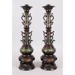 A GOOD PAIR OF EARLY BRONZE ORIENTAL ALTER STICKS / CANDLESTICKS, with cloisonne style decoration,