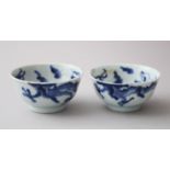 A PAIR OF 18TH CENTURY CHINESE DRAGON BOWLS, dragons amongst stylized clouds 9cm diameter x 4.3cm