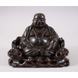 A CENTURY CHINESE BRONZE BUDDHA ON HARDWOOD STAND, in a seated position with his feet together