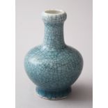 A MINATURE CHINESE CELADON CRACKLEGLAZE BOTTLE VASE, 8cm high.