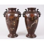 A GOOS PAIR OF JAPANESE BRONZE & MIXED METAL TANUKI VASES, the body of each vase inlaid with mixed