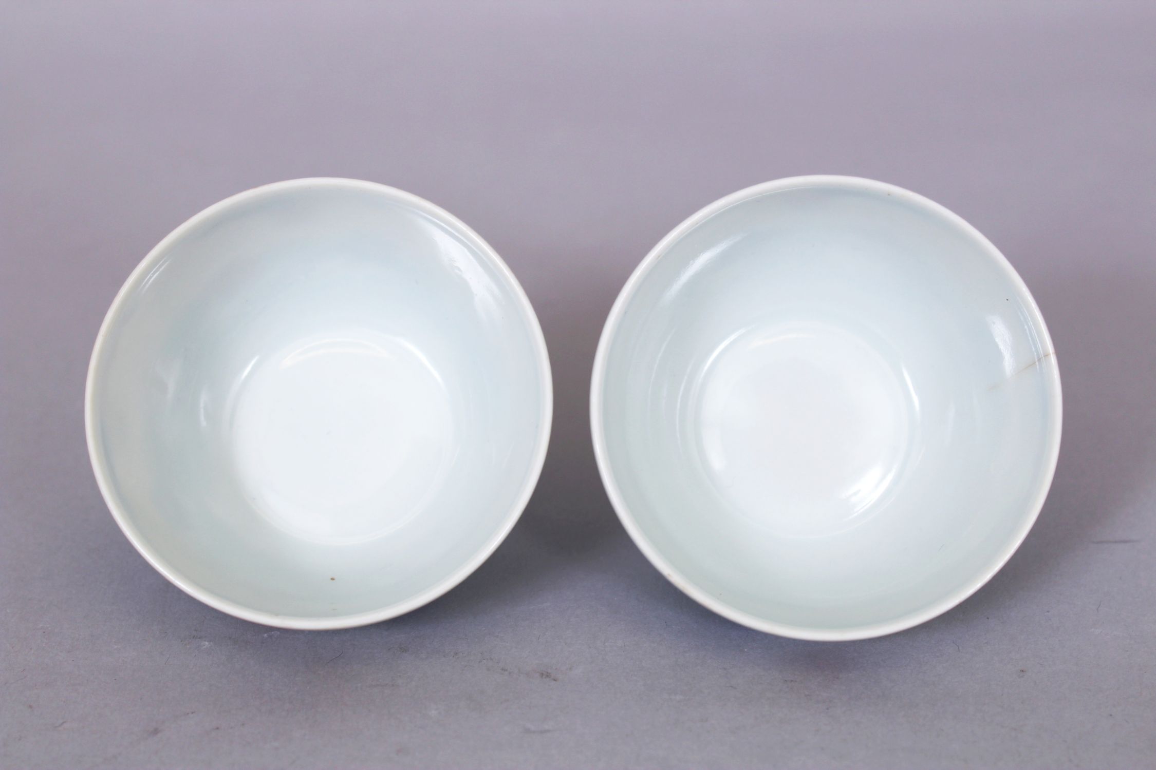 A SMALL PAIR OF CHINESE DOUCAI PORCELAIN WINE CUPS, each decorated with stylised waves bearing - Image 4 of 6