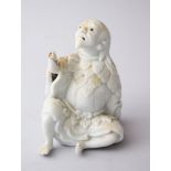 A 20TH CENTURY CHINESE BLANC DE CHINE PORCELAIN FIGURE OF LUOHAN, 9cm high.