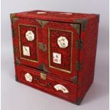 AN UNUSUAL JAPANESE CINNABAR LACQUER TABLE CABINET WITH SATSUMA PANELS, the front and top inset with