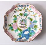 A 19TH CENTURY CHINESE FAMILLE ROSE SAUCER DISH, painted decoration to depict floral scenes , the