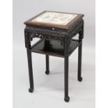A GOOD 19TH CENTURY CHINESE HARDWOOD STAND WITH A PORCELAIN CANTON FAMILLE ROSE TOP, the stand top