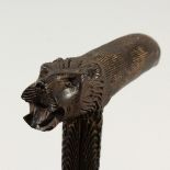 A CEYLONESE CARVED EBONY CANE. 88cms long.