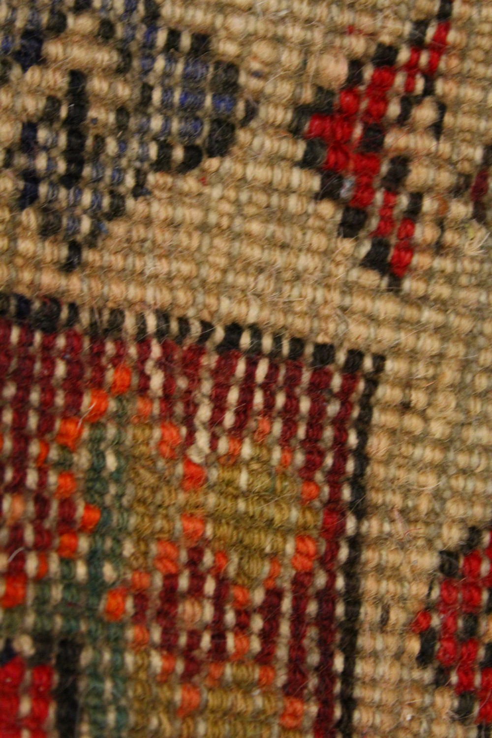 A PERSIAN LONG CARPET / RUNNER, bright red ground with three blue ground motifs in a stylized - Image 8 of 8