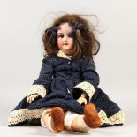 ARMAND MARSEILLE. A BISQUE HEADED DOLL with composition body and clothes. Stamped A6M. Made in