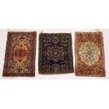 THREE SMALL PERSIAN RUGS, various sizes.