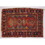 A SMALL PERSIAN RUG, with five small motifs in a triple border, worn. 250cms x 125cms.