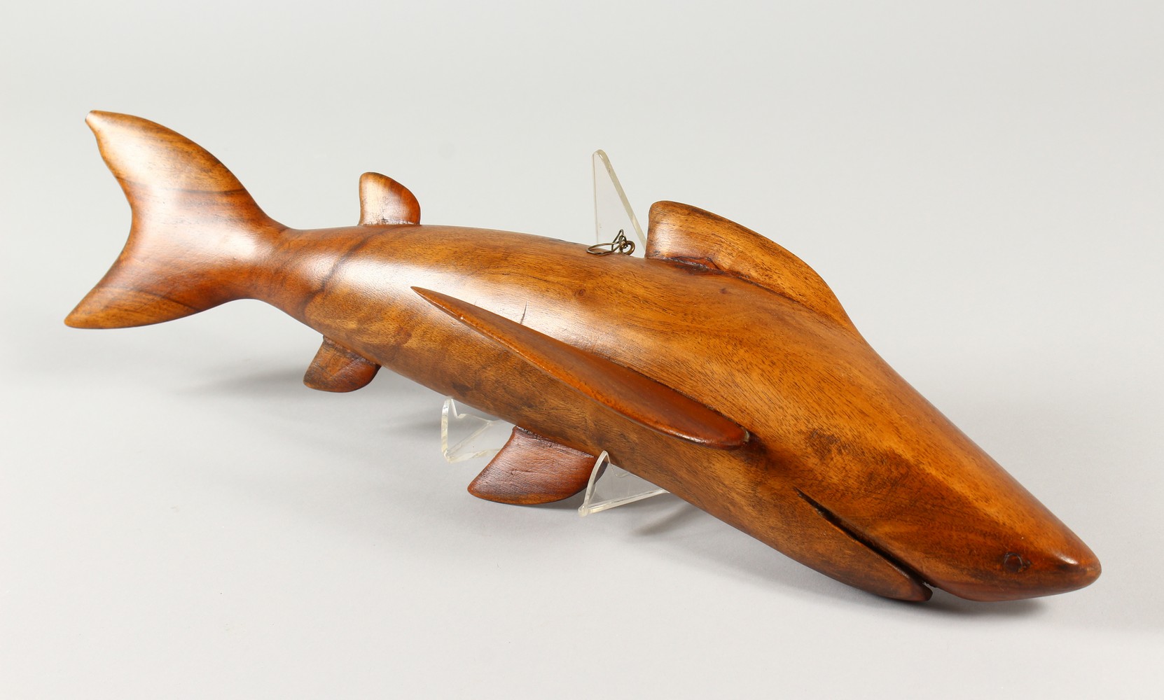 A PITCAIRN ISLAND CARVED WOOD SHARK by JOHN CHRISTIAN. Signed. 50cms long.