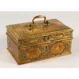 AN INDIAN RECTANGULAR BRASS SPICE BOX with carrying handle. 21cms long x 12cms wide.