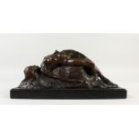 A BRONZE RECLINING FEMALE NUDE on a marble base. 32cms wide.