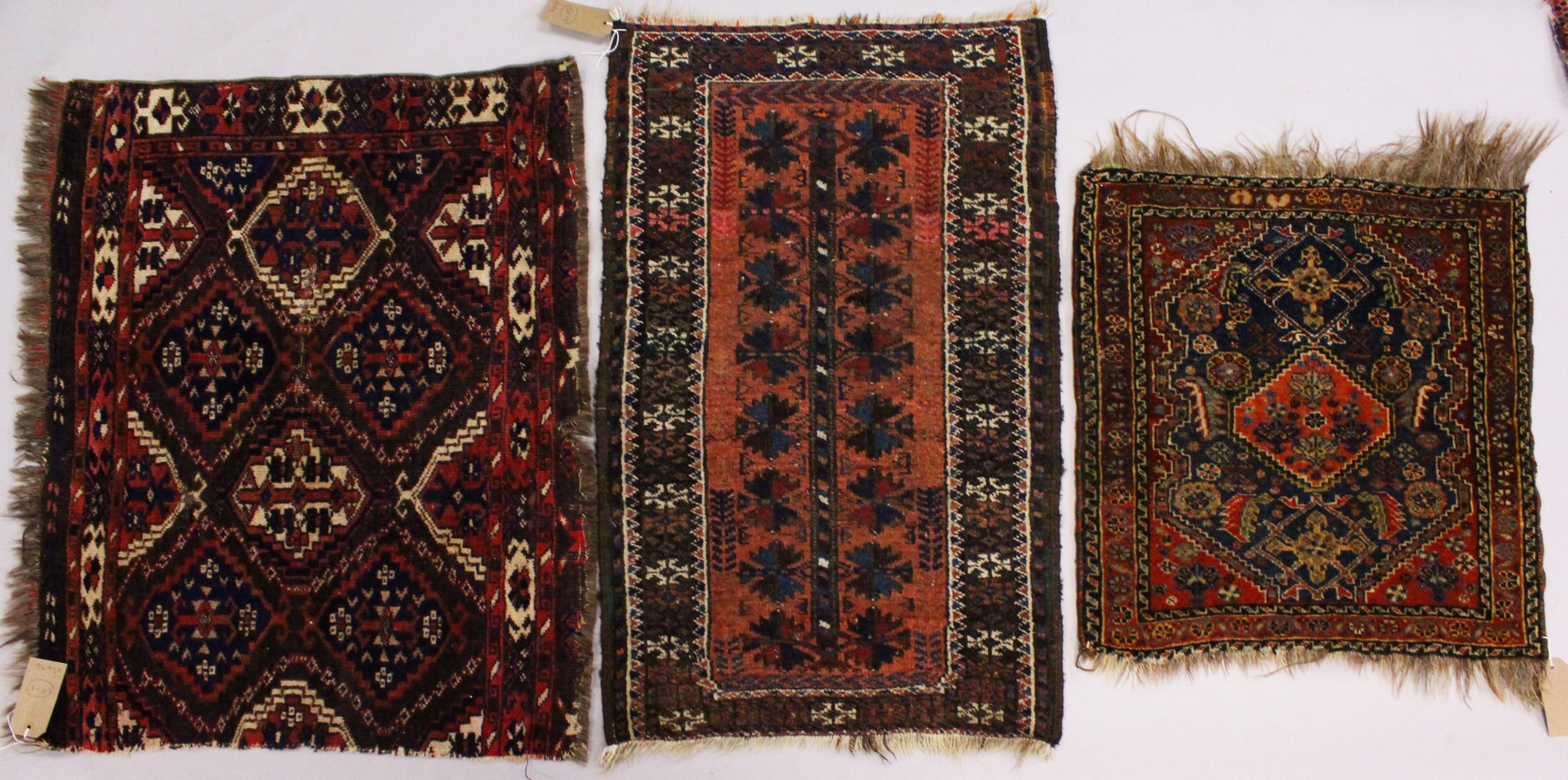 THREE SMALL PERSIAN RUGS, various sizes.