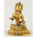 AN EASTERN GILT BRONZE FIGURE OF A SEATED DEITY. 20cms high.