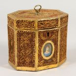 A GOOD REGENCY ROLLED PAPER OCTAGONAL TEA CADDY with a miniature of a young girl. 11cms high.