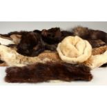 TWO MINK HATS AND TEN MINK STOLES.