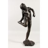 AFTER EDGAR DEGAS (1934-1917) FRENCH. A LARGE BRONZE OF A DANCER looking at her foot.. Signed Degas.