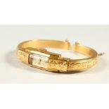 A LADIES' 18K GOLD BOUCHERON BANGLE WATCH.