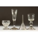A GEORGIAN WINE GLASS 12cms, A MOULDED GOBLET 7cms, A FLUTED WINE GLASS and A FUNNEL (4).
