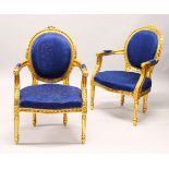 A PAIR OF FRENCH STYLE GILTWOOD AND BLUE UPHOLSTERED ARMCHAIRS.