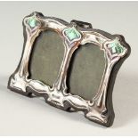 AN AT NOUVEAU STYLE SILVER AND ENAMEL PHOTOGRAPH FRAME. 11cms wide.