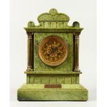 A LATE 19TH CENTURY GREEN MARBLE MANTLE CLOCK striking on a gong, ornate pierced brass dial, in an