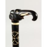 A CEYLONESE CARVED EBONY ELEPHANT CANE. 80cms long.