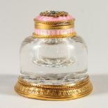 A RUSSIAN SILVER GILT, ENAMEL AND GLASS INKWELL, the lid inset with diamonds and rubies. 7cms high.