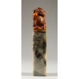 A CHINESE TALL CARVED SOAPSTONE SEAL. 20cms high.
