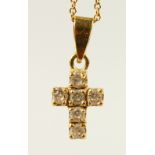 A GOLD AND DIAMOND SET CRUCIFIX AND CHAIN.