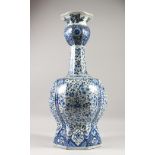 A LARGE PERSIAN STYLE BLUE AND WHITE VASE. 62cms high.