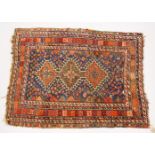 A SMALL PERSIAN RUG, pale blue ground with three motifs, in a multiple border. 140cms x 104cms.