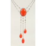 AN 18CT WHITE GOLD, DIAMOND AND CORAL SET NECKLACE.