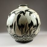 AN ART DECO DESIGN VASE painted with penguins. 30cms high.