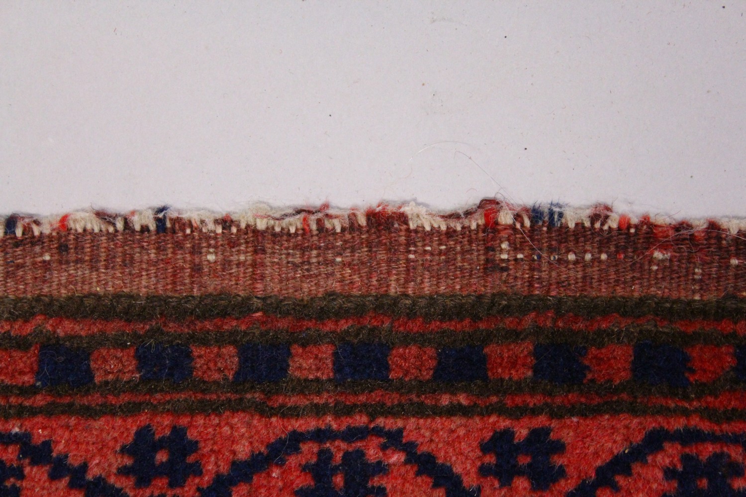 A PERSIAN RUG, dark blue ground, geometric motifs in a multiple border. 195cms x 110cms. - Image 5 of 8