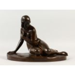 A GOOD SMALL FRENCH BRONZE FEMALE RECLINING NUDE, on a shaped base with foundry mark. 26cms wide.