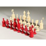 A GOOD RED AND WHITE STAINED AND CARVED IVORY CHESS SET. Queen 13cms high.