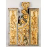 THREE 18TH CENTURY CARVED AND GILDED PANELS, with wheat ears fruiting vines, roses and scrolls.