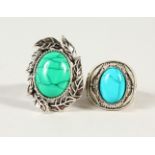 TWO SILVER AND TURQUOISE RINGS.