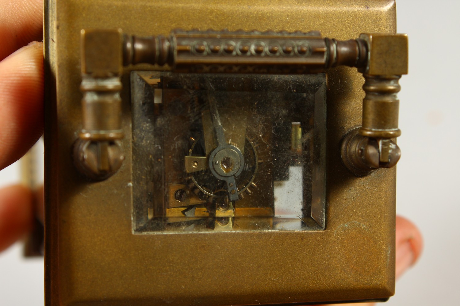 A MINIATURE BRASS CARRIAGE CLOCK, with alarm and subsidiary dial. 12cms high. - Image 5 of 7