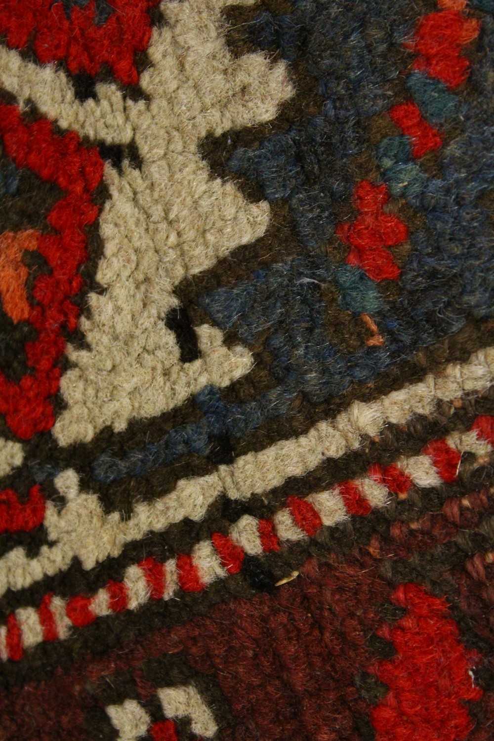 A PERSIAN RUG, red ground with six medallions, in a quadruple border. 200cms x 96cms. - Image 6 of 8